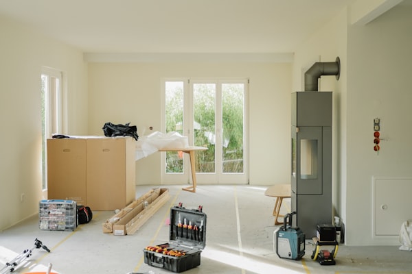 Room under renovation with tools and equipment